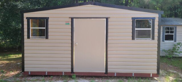 Durable outdoor storage shed in Hickory Moss with black trim